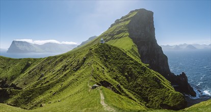 Denmark, Faroe Islands, Klaksvik, Trollanes, Kallur Lighthouse on sunny day