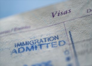 Close-up of immigration visa in passport