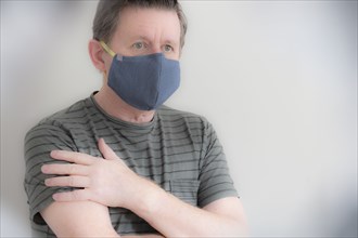 Mature man wearing protective face mask