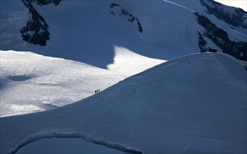 Climbers on mountain ridge at Monte Rosa Massif