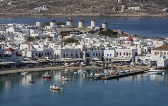 Fishing boats in harbor and white houses