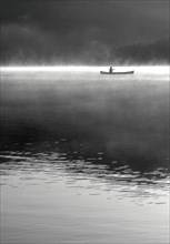 Woman canoeing on Lake Placid Lake