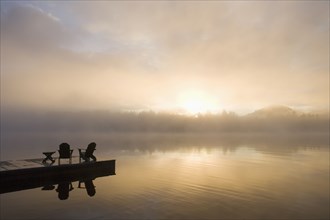 Morning mist on lake in Adirondack Mountains