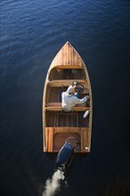 Man in motorboat on Lake Placid