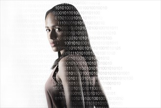 Portrait of woman with superimposed binary numbers