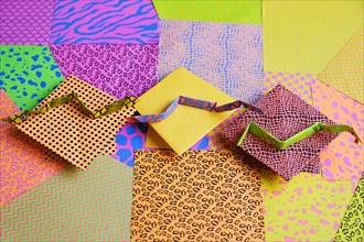 Origami snakes on colorful origami papers