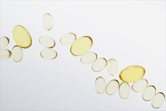 Fish oil pills on white background