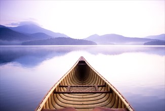 View of Whiteface Mountain from wooden canoe on Lake Placid