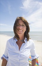 Portrait of smiling woman on beach