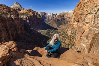 Senior woman at overlook above Zion Canyon in Zion National Park