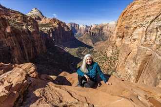 Senior woman at overlook above Zion Canyon in Zion National Park