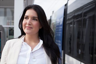 Young woman on train platform