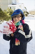 Boy making snowball
