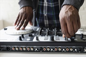 DJ using mixing desk