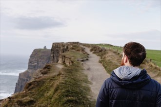 Mid adult man on The Cliffs of Moher