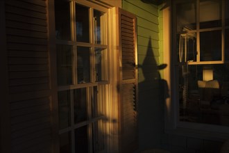 Shadow of witch on house