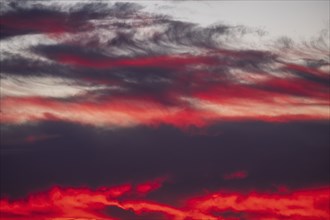 Dramatic sunset sky with red and purple clouds