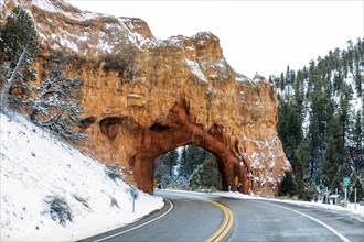 Road through sandstone arch near Bryce Canyon National Park