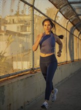 Woman jogging at sunset