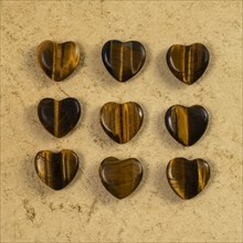 Wooden hearts on beige background