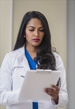 Female doctor with medical documents