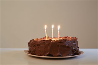 Candles in chocolate birthday cake