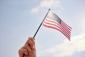 Hand holding American Flag