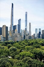 USA, New York, New York City, Skyscrapers near public park