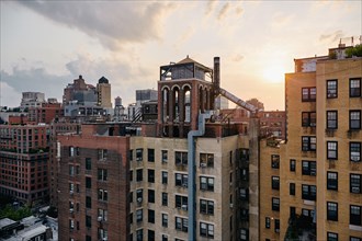 USA, New York, New York City, Apartment buildings at sunset