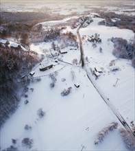 Poland, Subcarpathia, Odrzykon, Aerial view of village in winter