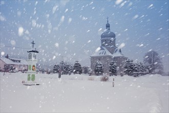 Poland, Subcarpathia, Rzeszow, Church at town square during winter snowfall