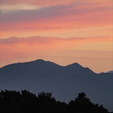 Usa, New Mexico, Sandia Mountains From Santa Fe, Colorful skies over Sandai Mountains at sunset