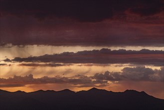 Usa, Idaho, Bellevue, Storm clouds over mountains at sunset