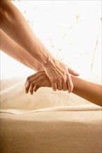 Woman receiving hand massage