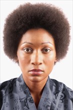 Studio portrait of woman with afro hair