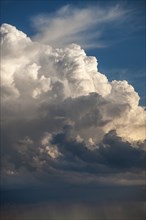 Cumulus storm clouds and rain
