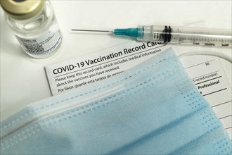 Syringe on Covid-19 vaccination record card