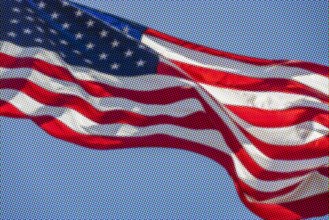 Pixelated American flag waving against sky