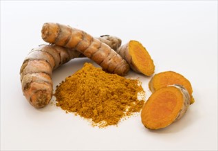Turmeric powder and root on white background