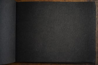 Close-up of black paper in photo album