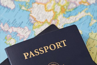 Close-up of passports on map