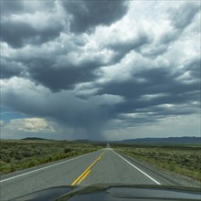 Highway under stormy sky