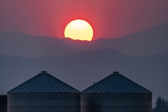 Storage silos at sunset