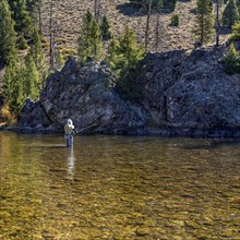 Woman fly-fishing in Salmon River