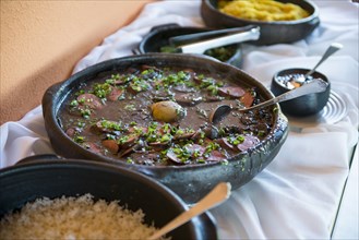 Bowls of traditional beans and rice on buffet table
