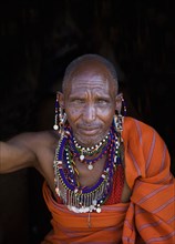 Black man wearing traditional jewelry and clothing
