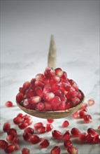 Close up of pomegranate seeds in spoon