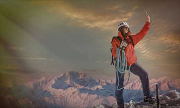 Caucasian hiker taking selfie on mountaintop