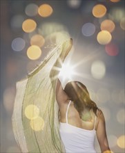 Caucasian woman waving scarf