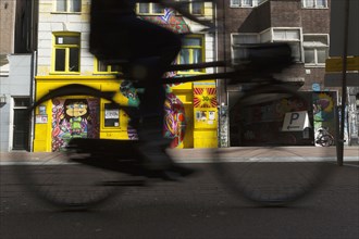 Blurred view of bicyclist on city street